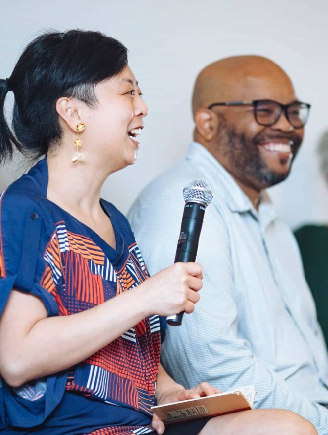 Diana Lu and Shawn Mooring speak on a panel discussion.