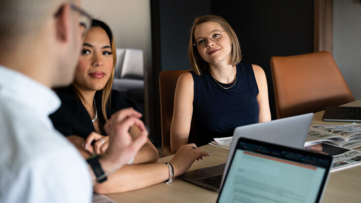 Lenfest Institute employees sit around a conference table.