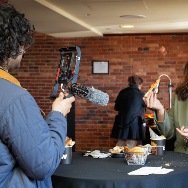 Baltimore Banner Audience Engagement Editor Krishna Sharma films a TikTok.