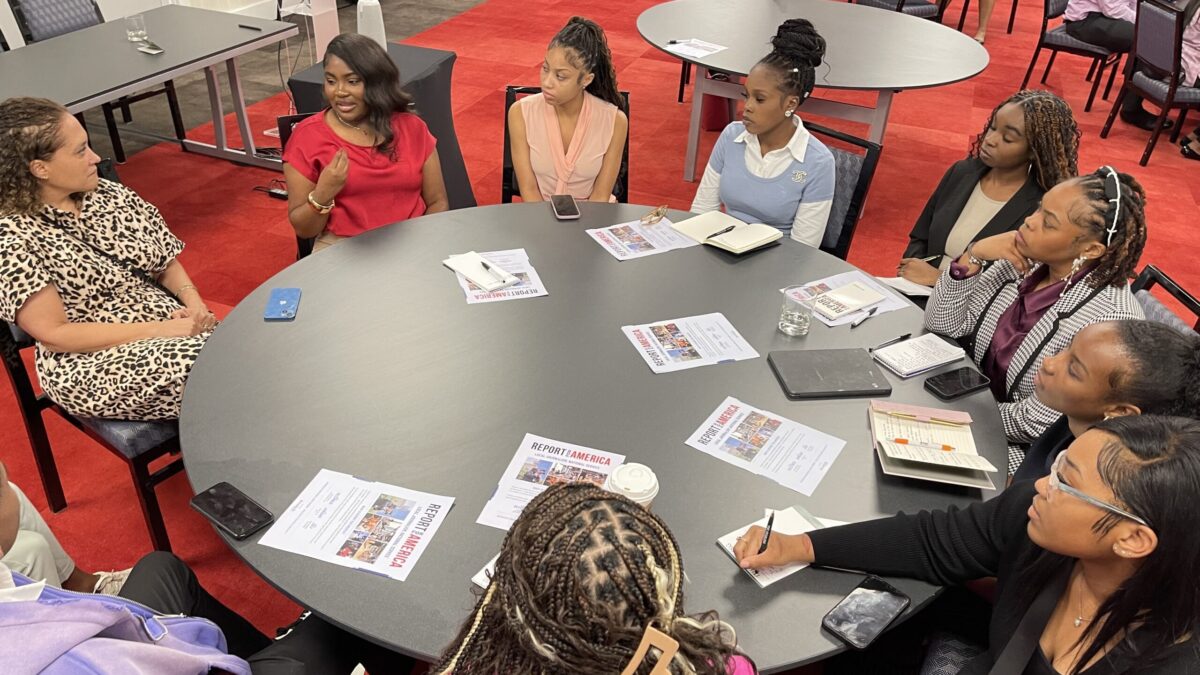Students sitting around a circle table