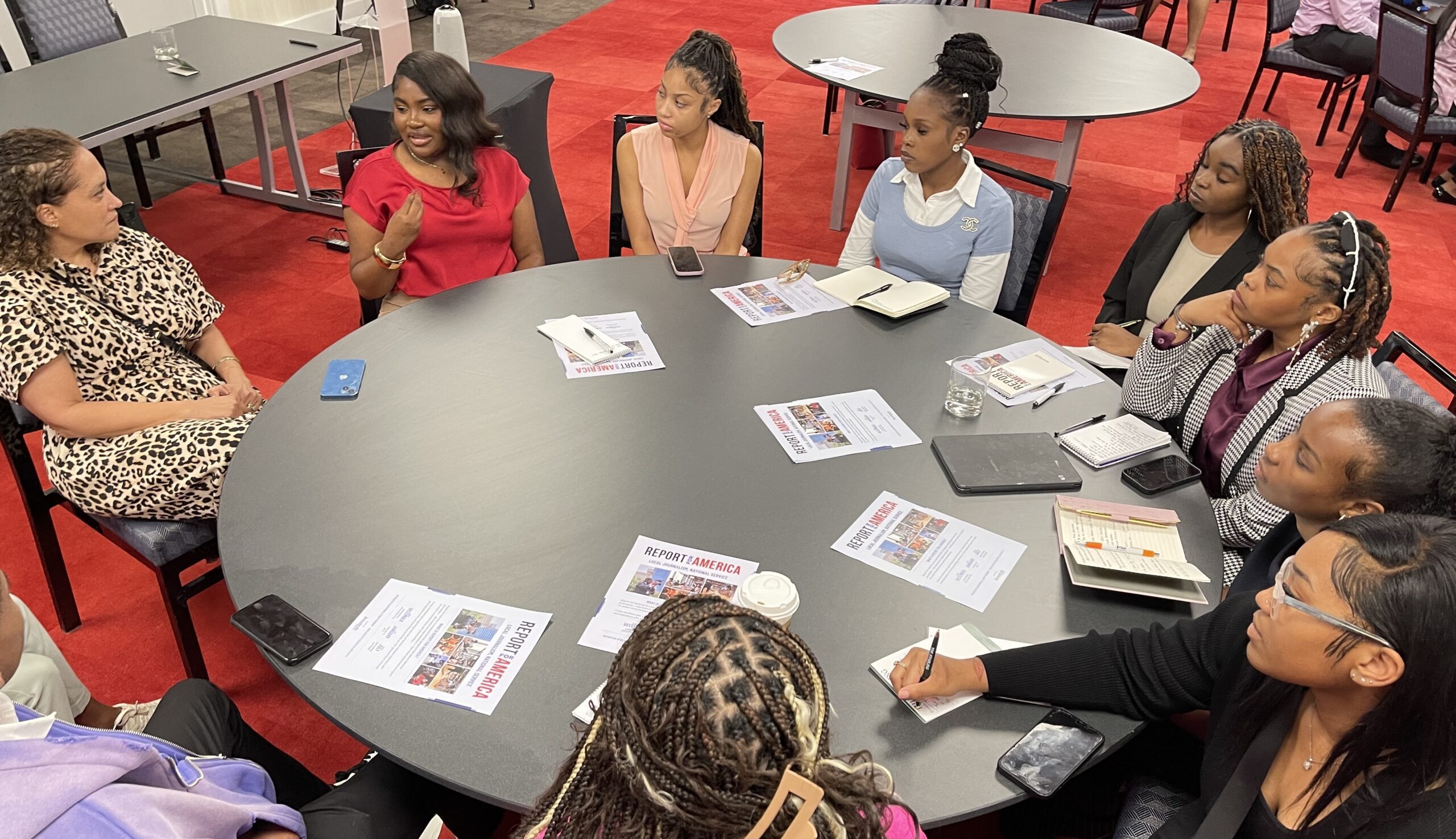 Students sitting around a circle table