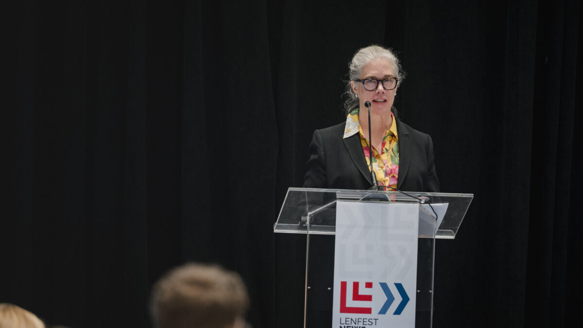 Annie McCain speaking at a podium at the 2026 Lenfest News Philanthropy Summit